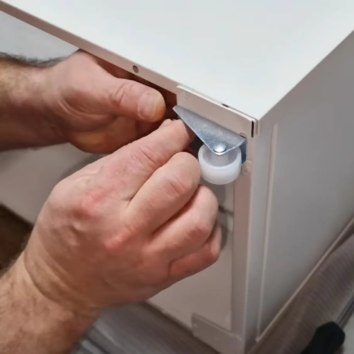 Amateur video guide: hands fitting a caster